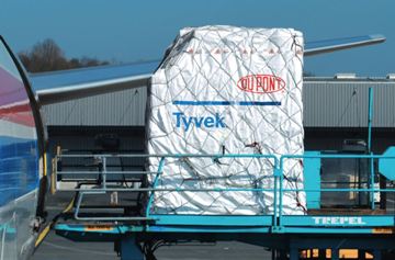 DuPont Tyvek Cargo Cover on pallet, loading onto plane.